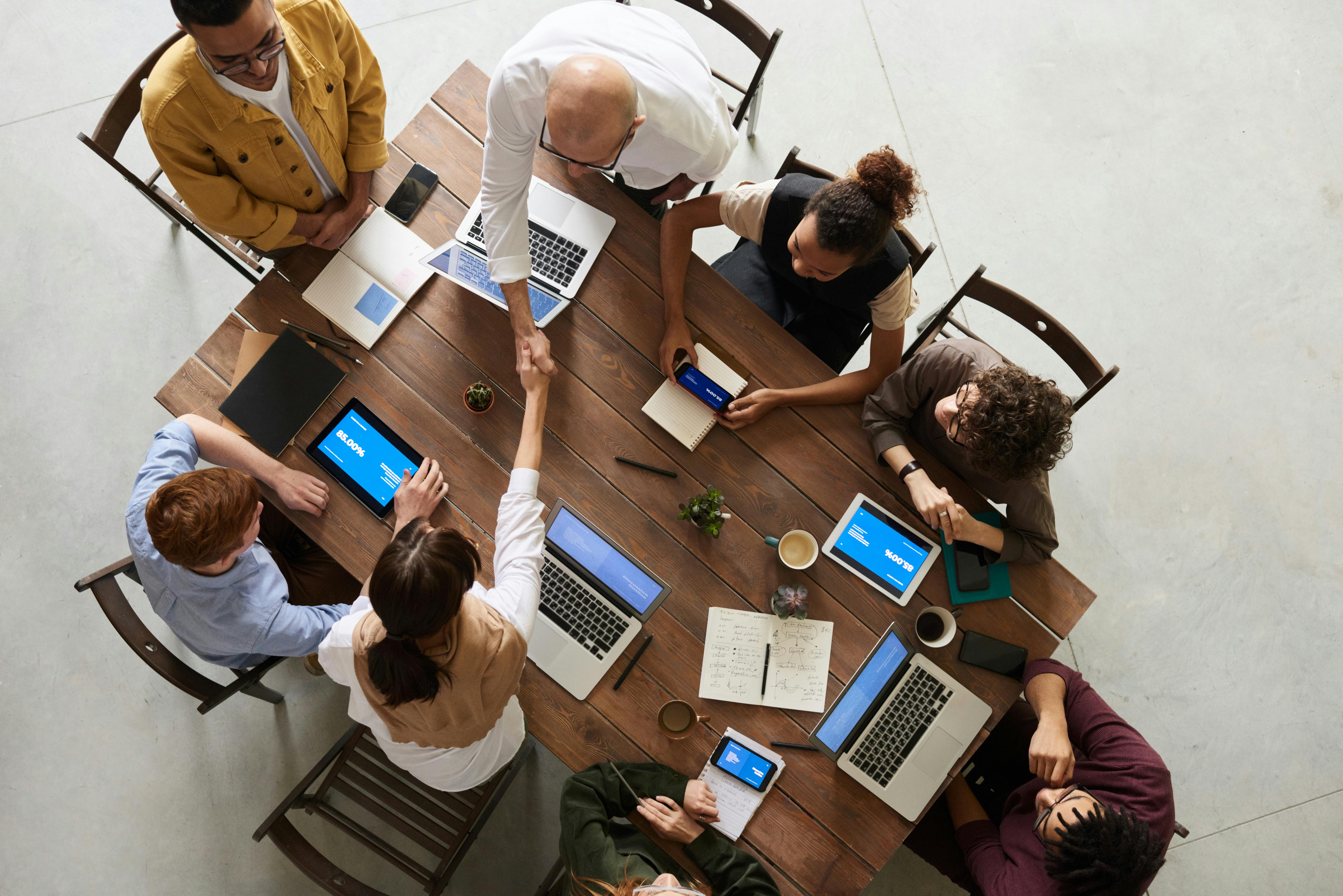 Business team reviewing a massive enterprise proposal document